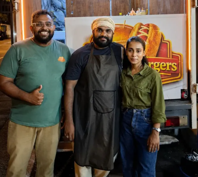 The brothers with a happy customer